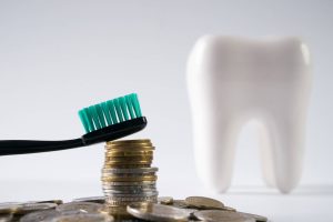 The government has agreed to review a temporary adjustment to pay for community dentists in Northern Ireland